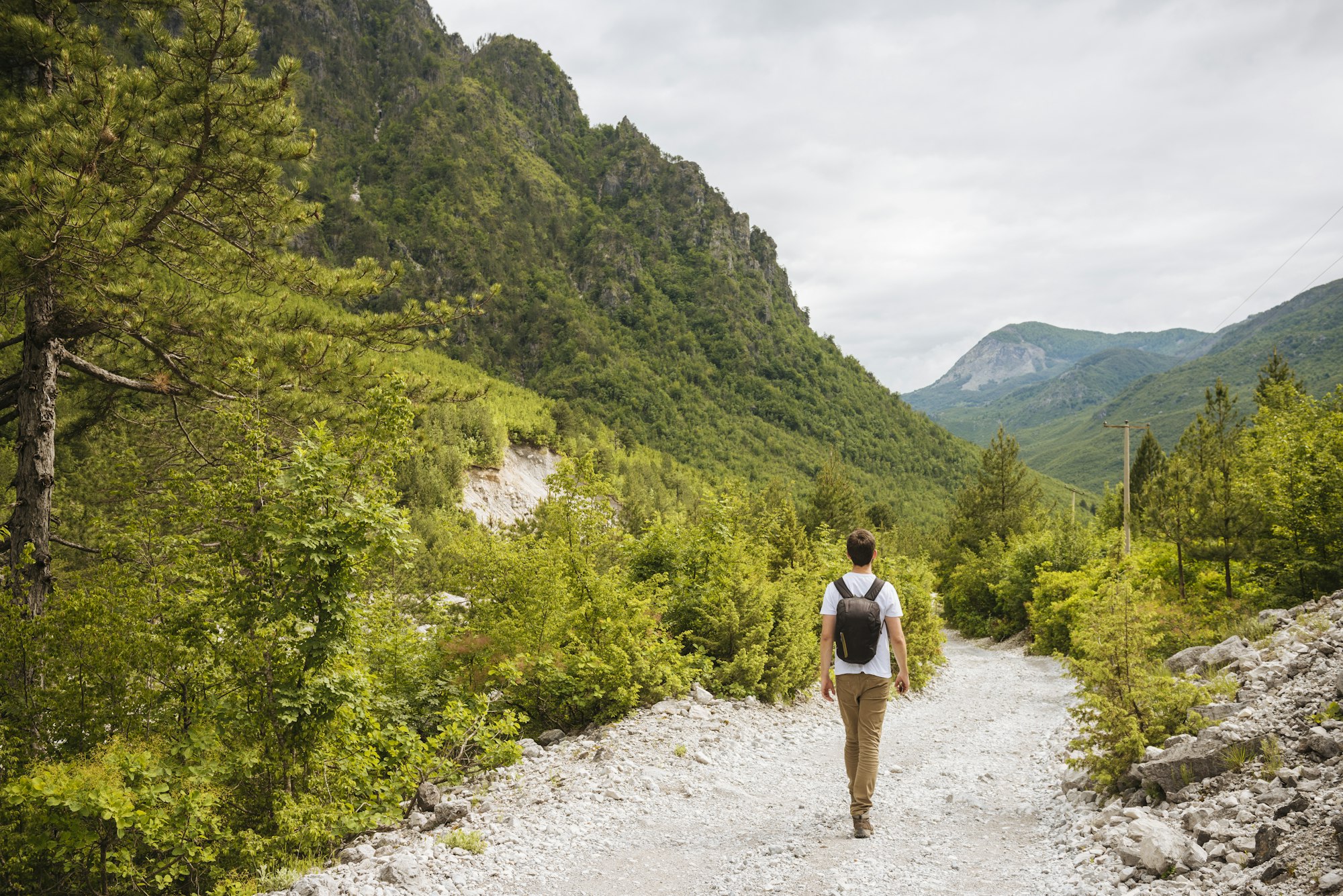 Hiker hiking in Accursed mountains, Theth, Shkoder, Albania, Europe