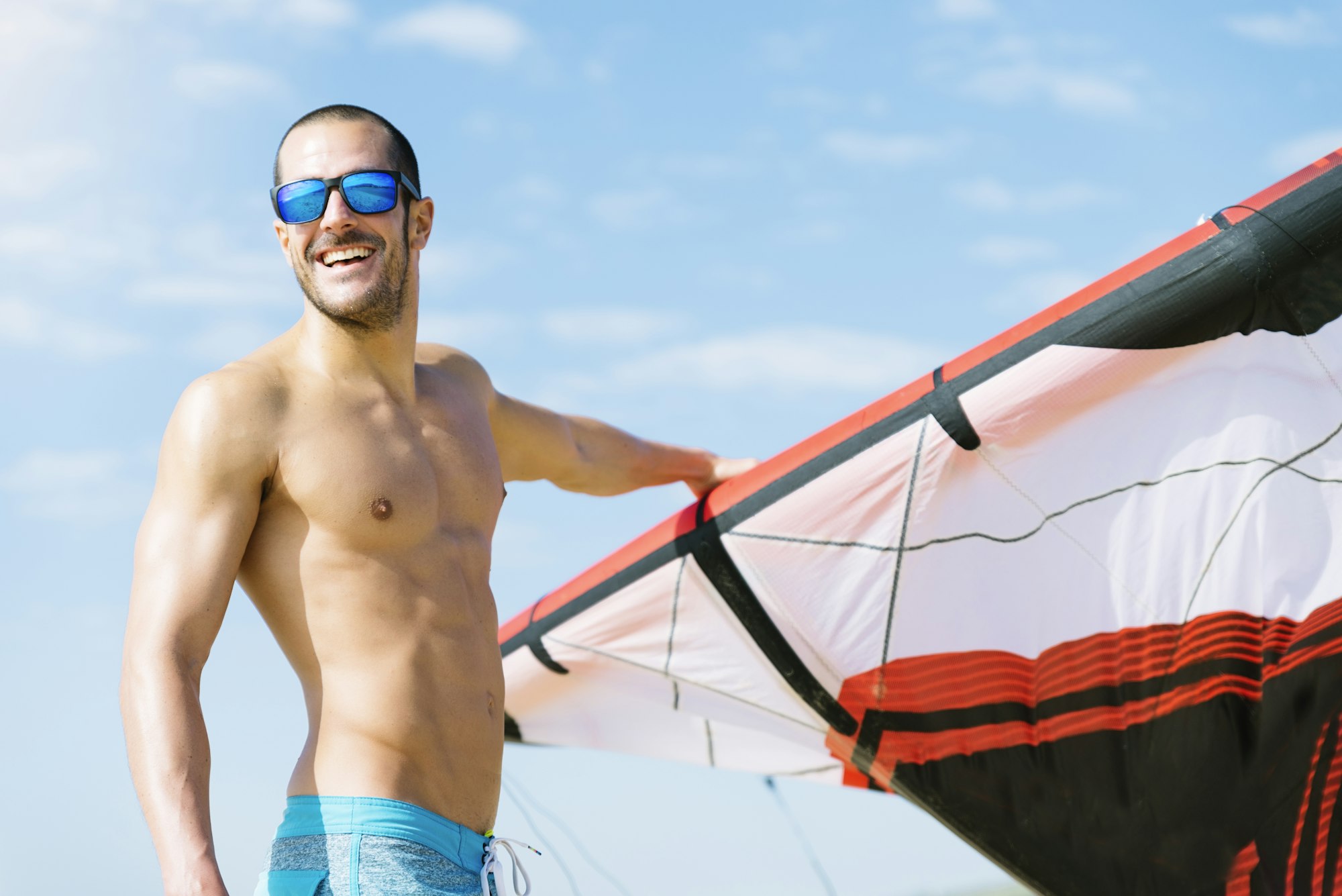 Portrait of handsome man kitesurfer.